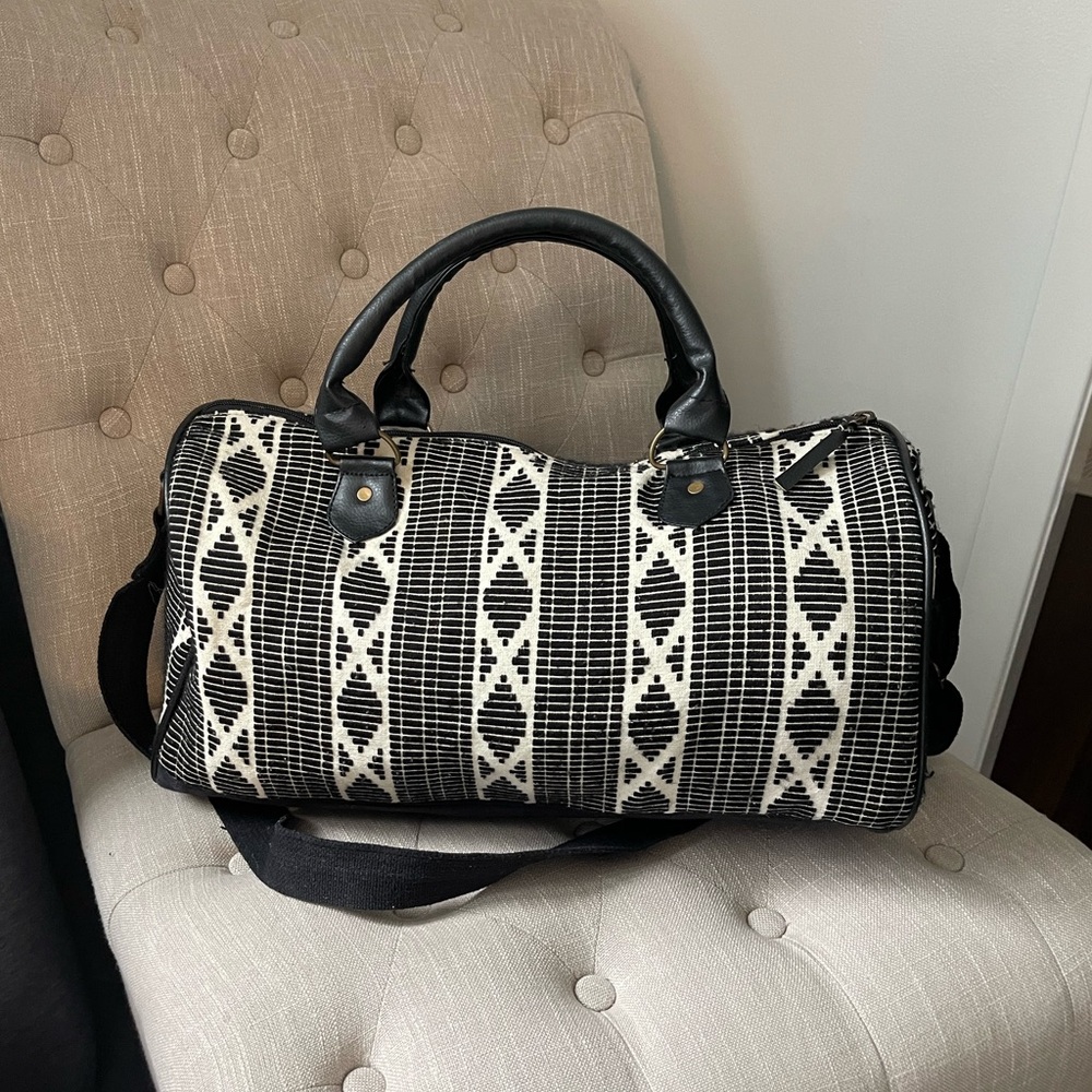 Mossimo supply co duffel bag. Black and white pattern. 9in by 18in by 9 in